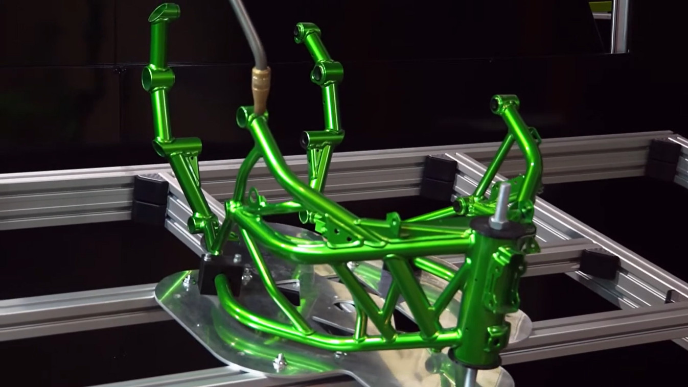 Robotic inspection system scanning safety-critical automotive seating subassembly welds